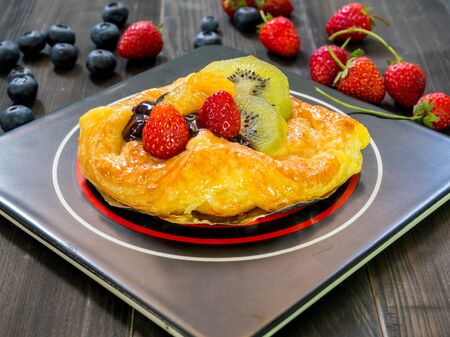 Homemade fresh pie with mixed organic berries fruitsの写真素材