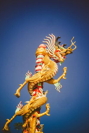 Power and colorful from dragon statue in templeの写真素材
