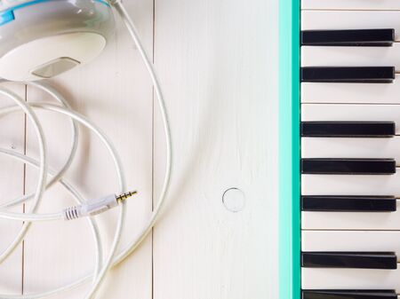 Vintage melodion and  old headphone on white backgroundの写真素材