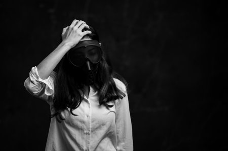Stressed Asian women must use a gas mask to prevent dust pollution and prevent infection from...