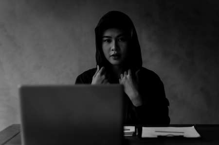Young Asian hackers are searching for information on the internet and using it illegallyの写真素材