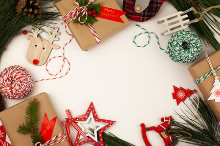 handmade Christmas gifts packed in kraft paper and decorated in eco style with natural sprigs of...