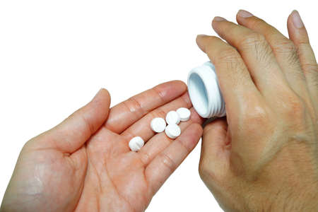 Take a headache medicine,Healthcare, treatment,supplements concept photoの写真素材