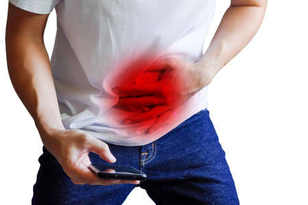 Man with a stomachache calling 911 on a white backgroundの写真素材