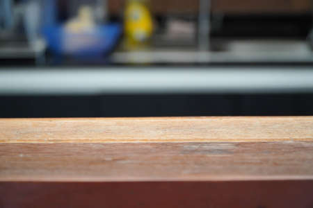 wooden table blank in front of abstract blurred background