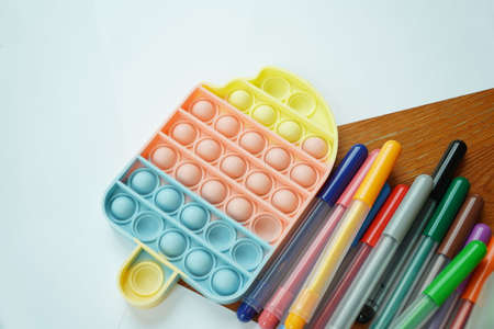 Colorful paper and magic pens on a wooden table,learning conceptの写真素材