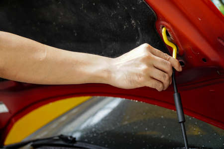 Asian man open car hood for repair as maintenance service