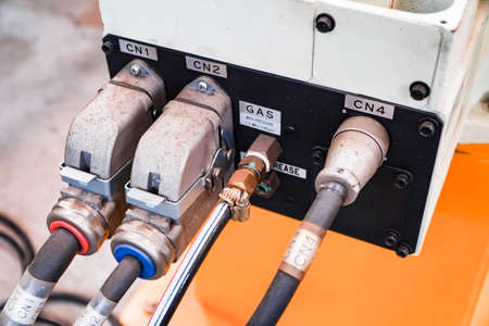 jack plugs the electric welding robot in the factory.の写真素材