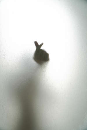 Korean symbol of love with your fingers fingers glass is wet.の写真素材