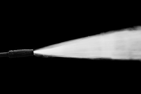 high pressure water gun on black backgroundの写真素材