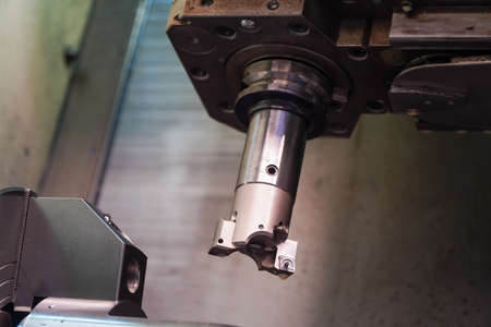 Solid steel metal workpieces mounted on spindle chucks of high-precision CNC automatic lathes,...