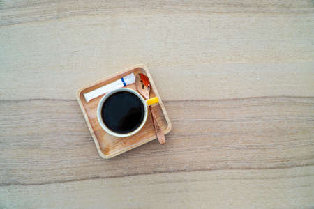 hot coffee mug on wooden table,coffee conceptの写真素材