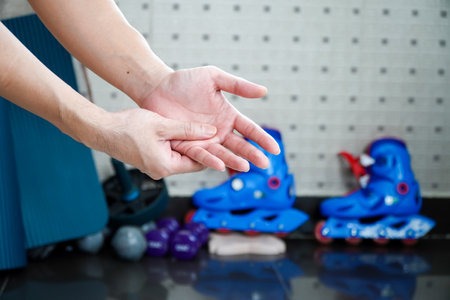 Man holding hands in pain after playing sports â concept of painの写真素材