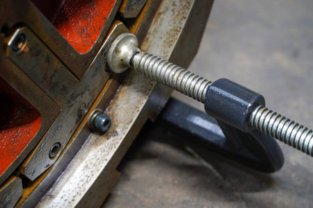 C-Clamp clamping CNC machine parts in industrial plants,Steel workshop concept,C steel clampsの写真素材