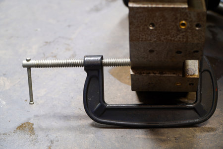 C-Clamp clamping CNC machine parts in industrial plants,Steel workshop concept,C steel clampsの写真素材