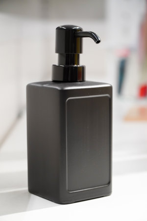 black bottle of hand sanitizer white backgroundの写真素材