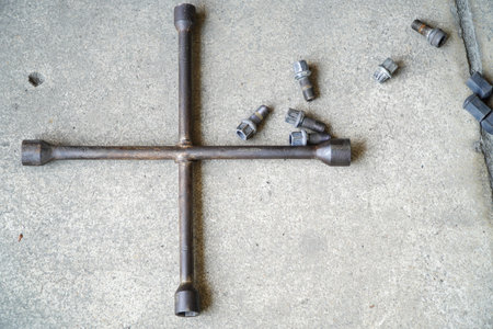 Installing passenger car wheels and replacing brake discs and brake pads on cloudy winter daysの写真素材