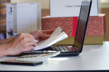 Happiness at home office with online business Asian men's online marketing and freelance work.の写真素材
