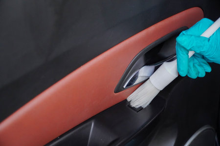 female staff cleaning the interior of the car, car detailing (or valeting) concept.の写真素材
