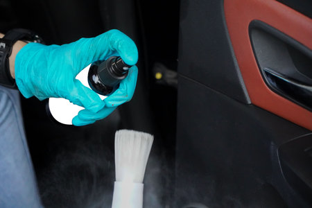 female staff cleaning the interior of the car, car detailing (or valeting) concept.の写真素材