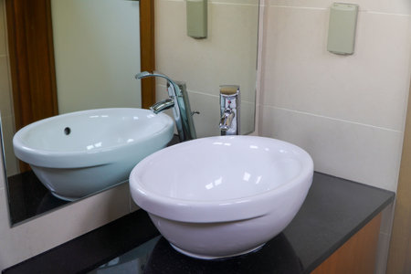 Interior of a modern bathroom with sink and faucet.の写真素材