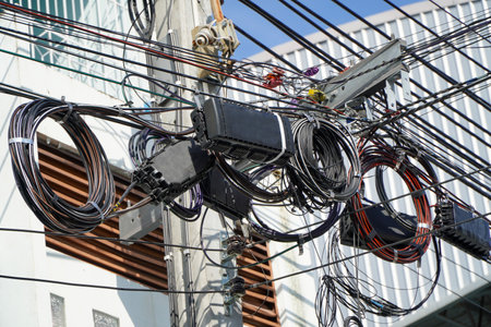 Electrical wires and cables on electric pole in Bangkok, Thailand.の写真素材