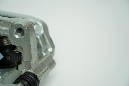 Rear brake caliper with brake pads isolated on white background,Car part on a white background, close-up, isolate.の写真素材