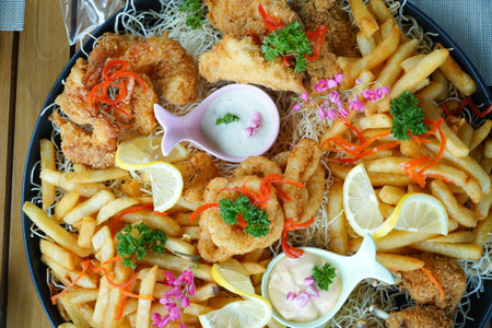 Crispy fried fish with french fries and mayonnaise sauceの写真素材
