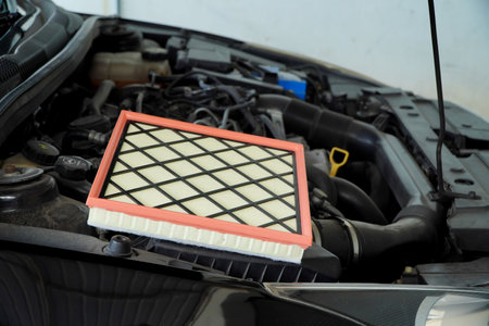 Close up of a car air filter in a car repair shop.
