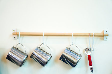 Kitchen tools hanging on the wall in the kitchen, stock photoの写真素材