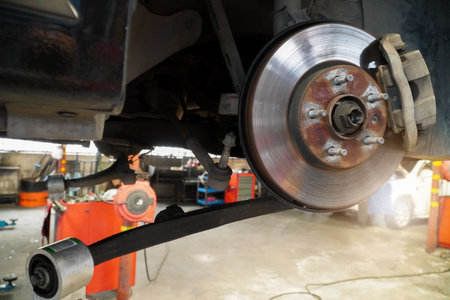 brake disk and brake system of a car in a repair shopの写真素材