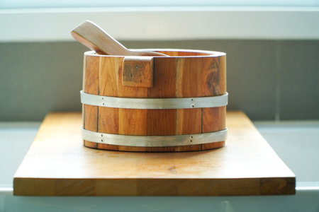 Wooden sauna bucket with a wooden spoon on a wooden stand,Interior Finnish sauna