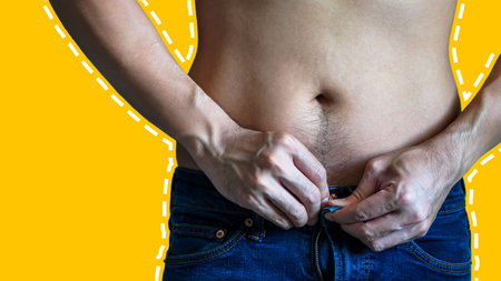 Man with fat belly on yellow background. Diet and weight loss concept