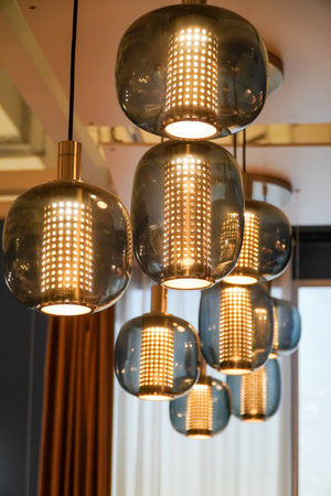Modern chandelier in living room,interior loft style building. Retro lighting decoration.の写真素材