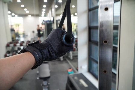 Close-up of hand of a man working out in a gymの写真素材