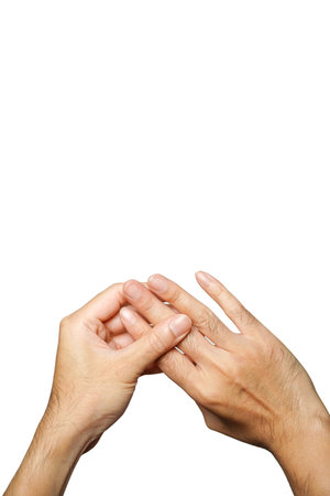 Cropped of man suffering from pain in hand and massaging his painful finger,white background,Finger nerve therapy conceptの写真素材