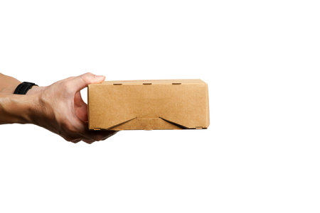 Hand holding a brown cardboard box with a recycling sign on a white background.Ideas for choosing recycled boxes,cardboard box for delivery on a white backgroundの写真素材
