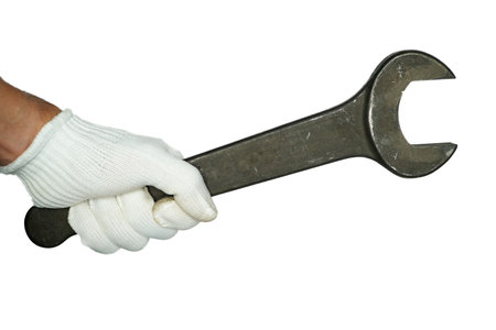 Hands in white gloves holding a spanner,isolated on white background,builder,repairman, handyman,の写真素材