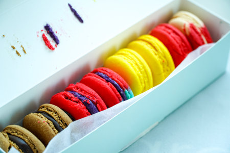 Colorful macarons in a box on a white table.Macaron or macaroon is French popular dessert for served with afternoonの写真素材