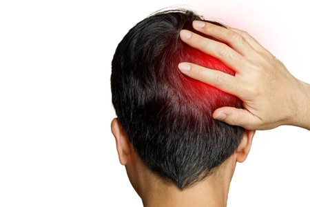 Migraine,Man with a headache on a white background.headache, stress, tension problem, hangover concept, businessの写真素材