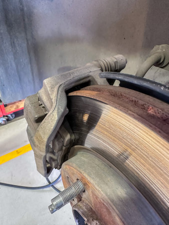 brake pads and brake discs of a car in a car repair shopの写真素材