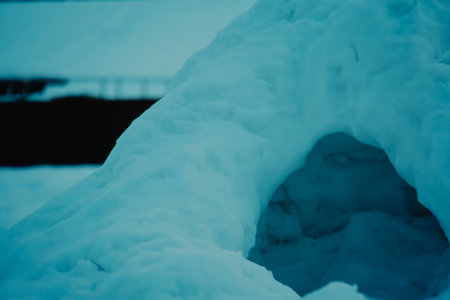 Close up of a snow shelter entrance