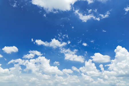 Blue sky background with cloudsの写真素材
