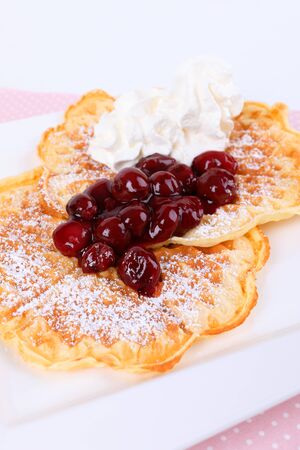 Waffles with cherries and creamの写真素材