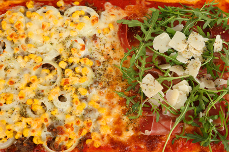 a large family pizza with mixed toppingsの写真素材