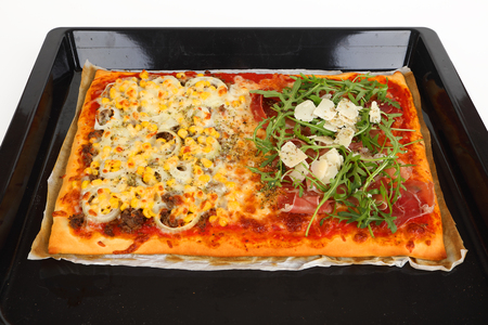 a large family pizza with mixed toppingsの写真素材