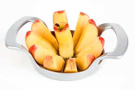 A red apple with a apple cutterの写真素材