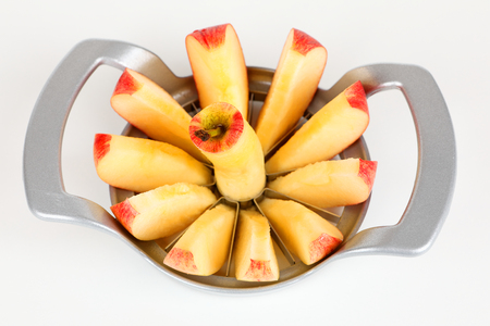 A red apple with a apple cutterの写真素材