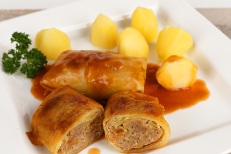 cabbage roulade with potatoes on a plateの写真素材