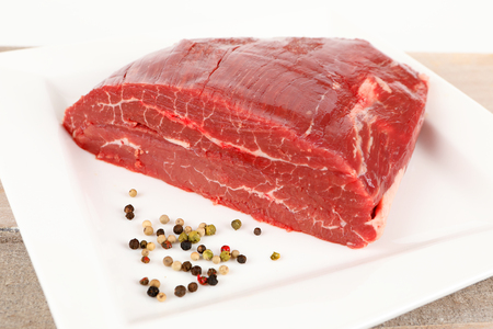 a piece of raw dry aged flank steakの写真素材